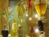 An array of perfume bottles, including Bouquet, Pupa, 1985 (black/silver, far left)