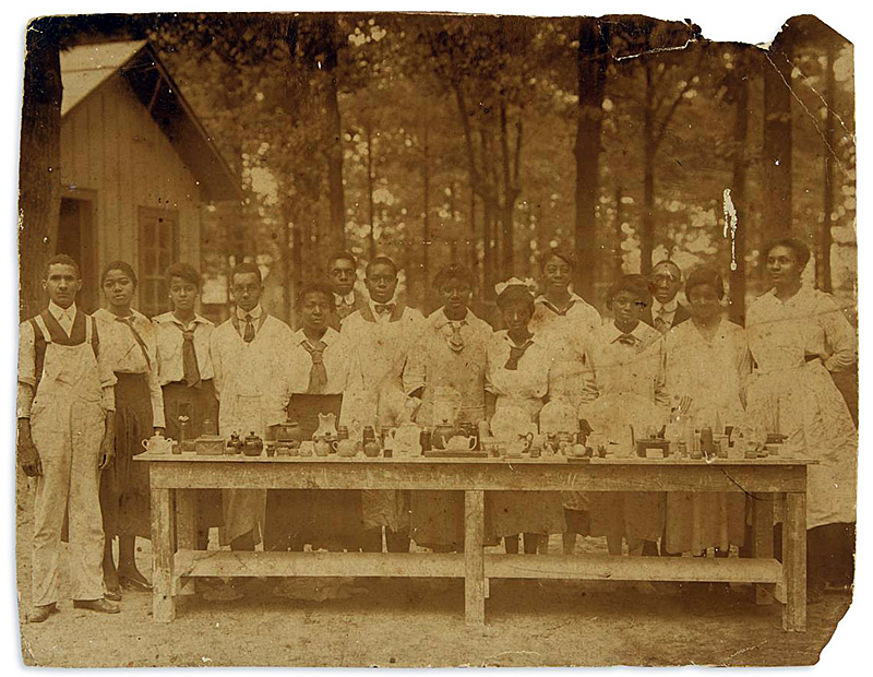 Artist Isaac Scott Hathaway with ceramics students at Tuskegee Institute. Photo from swannauctiongalleries.com.