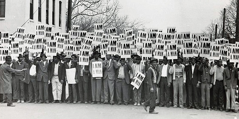 Striking sanitation workers carry "I AM A MAN" signs in Memphis, 1968.