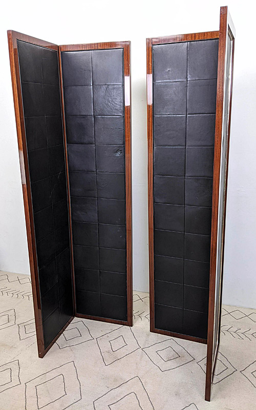 Pair of two-panel mahogany and leather folding screens. 