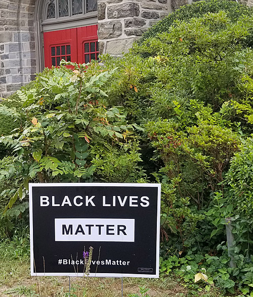 "Black Lives Matter" yard sign on the front lawn of a church. 