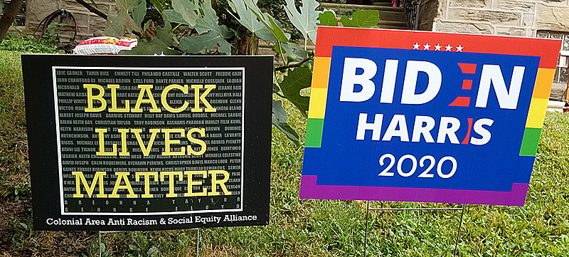 "Black Lives Matter" yard sign shares space with a campaign sign. 