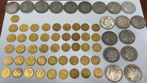 Antique coins found by a couple in a drawer in their new home. They returned the coins - worth an estimated $25,000 - to the owner. 