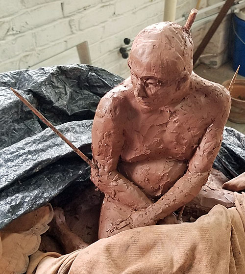 A sculpture waits to be completed. 