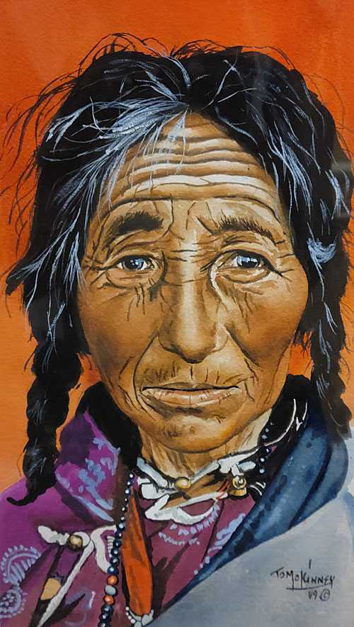 A Native American among Tom McKinney's paintings. 