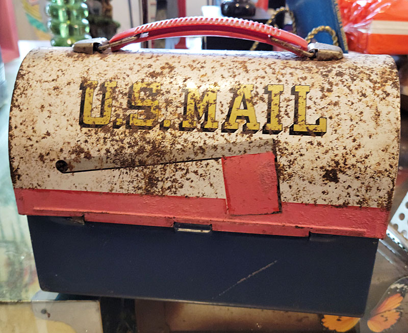 This U.S. Post Office lunchbox exemplifies he love for "mailmen." 